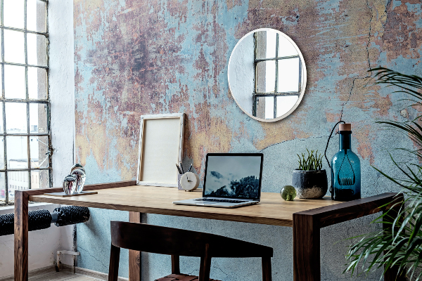 Een ronde spiegel in een witte lijst voor in de hal fi 70 cm